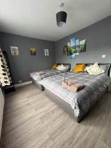 Ένα ή περισσότερα κρεβάτια σε δωμάτιο στο Hatton Homes: Tottenham (Thackery Avenue)