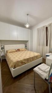 a bedroom with a large bed in a room at Baia Aurora in Letojanni
