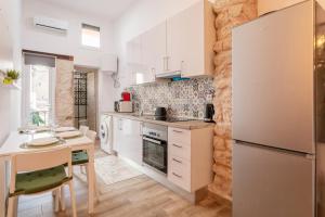 Kuchyň nebo kuchyňský kout v ubytování Bel appartement rustique au cœur d'Alicante