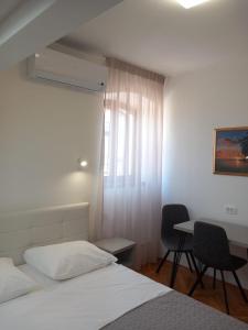 Postel nebo postele na pokoji v ubytování Marjan apartment & rooms