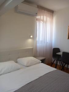 Postel nebo postele na pokoji v ubytování Marjan apartment & rooms