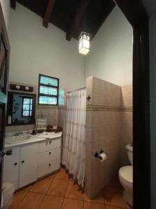 a bathroom with a sink and a toilet at Casa San Miguel in Antigua Guatemala