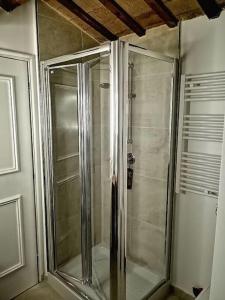 a shower with a glass door in a bathroom at CASA LITA con terrazzo in Ravenna