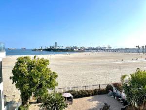a view of a beach from a building at Beautiful Bright Condo Steps Away from the Beach in Long Beach