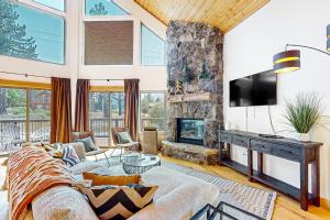 a living room with a couch and a fireplace at Eagle Escape in South Lake Tahoe