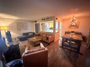 a living room with a couch and a table at Charming 2 Bed Mid-City Living only 7 Min to Downtown in Tucson