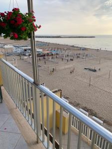 a balcony with a view of a beach at Terrazza sul mare in Scoglitti