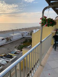a balcony with a view of the beach at Terrazza sul mare in Scoglitti