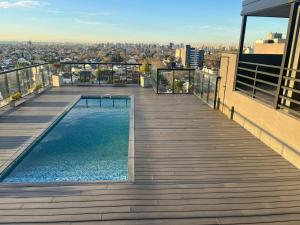 a balcony with a swimming pool on top of a building at Ministro Brin Suite MT in Remedios de Escalada