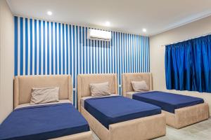 A bed or beds in a room at Bedcoin Hostel