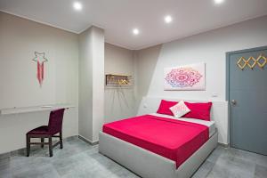 A bed or beds in a room at Bedcoin Hostel