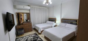 Lova arba lovos apgyvendinimo įstaigoje Elite Apartment in sheraton Heliopolis 5 minutes from Cairo Airport