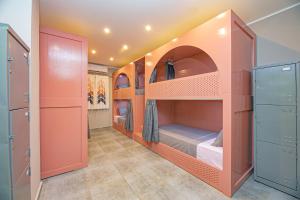 A bed or beds in a room at Bedcoin Hostel