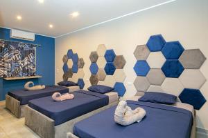 A bed or beds in a room at Bedcoin Hostel