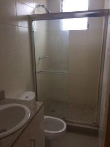a bathroom with a shower with a toilet and a sink at PH 4 Islas Budget Business Flat with 2 Rooms fitting up to 6 people in Panama City