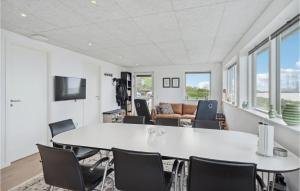 a living room with a white table and chairs at Stunning Home In Esbjerg V With Kitchen in Esbjerg