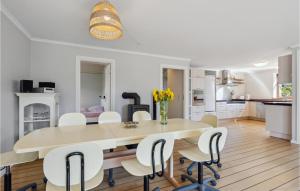 a kitchen and dining room with a table and chairs at Beautiful Home In Nrre Nebel With Kitchen in Nørre Nebel