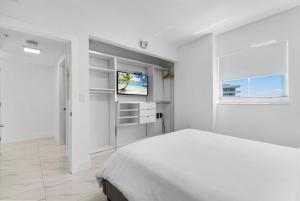 Postel nebo postele na pokoji v ubytování Fortune House Hotel Suites