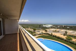 a view from the balcony of a hotel with a swimming pool at Apartamentos Be Suites Mediterráneo in Oropesa del Mar