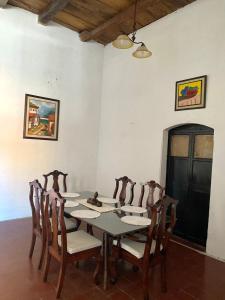 a dining room with a table and chairs at Casa Colonial in Suchitoto