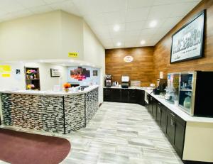 a lobby of a hospital with a reception counter at Super 8 by Wyndham Winona MN in Winona