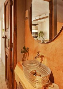 a bathroom with a sink and a mirror at Casa Boutique 55 in San Cristóbal de Las Casas