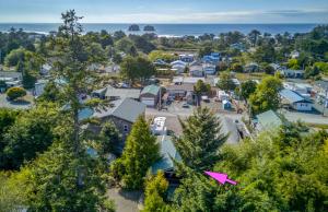 an aerial view of a small town with houses and the ocean at Sand Dollar Cottage Rockaway - Meredith Lodging in Rockaway Beach