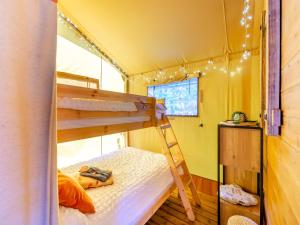 a bunk bed in a tiny house with a ladder at The Foxes Den - Uk45295 in Bishop Thornton