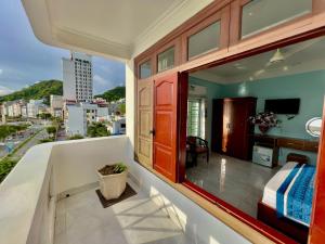 a balcony with a view of a city at Phoenix Flower Hotel in Cat Ba
