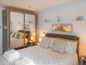 a bedroom with two beds and a mirror at The Hive in Newcastle upon Tyne