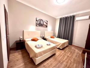 Postel nebo postele na pokoji v ubytování Golden Milano Hotel