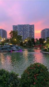 a large body of water with buildings in the background at VINHOMES GRAND PARK QUẬN 9 Căn hộ bnb 1pn in Gò Công