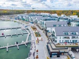 an aerial view of a harbor with buildings and water at Friday Harbour Resort Marina Cottage on Simcoe in Innisfil