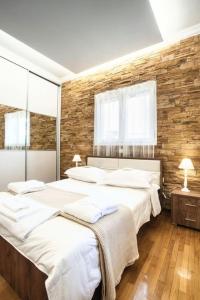 Ένα ή περισσότερα κρεβάτια σε δωμάτιο στο Kifisia Kallisti Suites