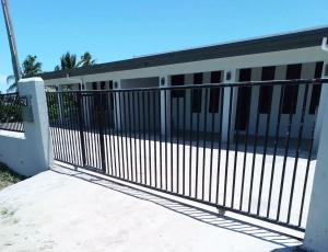 a gate in front of a building at Two Bedroom Holiday Home- Olosara Sigatoka Guest House in Singatoka