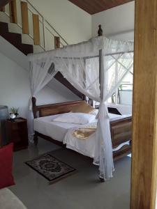 A bed or beds in a room at Tea Hills Bungalow