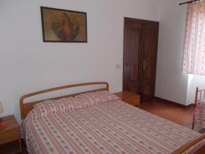 A bed or beds in a room at Casa Vacanze Liperni