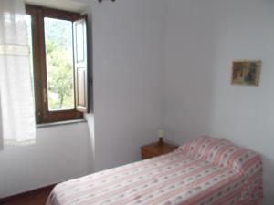 A bed or beds in a room at Casa Vacanze Liperni