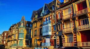 a row of houses with balconies on a street at Villa Liberty in Gamaches