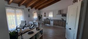 a kitchen with a table and a chair in a room at Apartamento Soniando en Guara in Buera