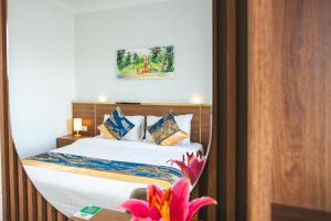 Postel nebo postele na pokoji v ubytování M9 Kirirom Hotel