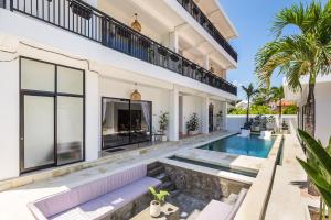 an image of a villa with a swimming pool at Modern Industrial Apartment-Umalas w Wifi and pool in Canggu