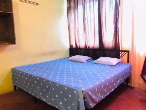 Postel nebo postele na pokoji v ubytování Coca Cola Hostel Malabe