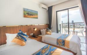 Postel nebo postele na pokoji v ubytování M9 Kirirom Hotel + 37 fotografií