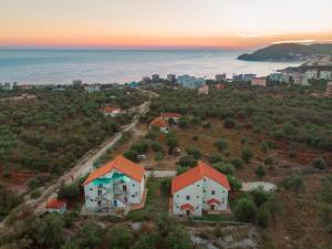 an aerial view of a house on a hill next to the ocean at Aria Prive in Himare