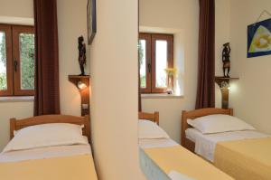 Postel nebo postele na pokoji v ubytování Apartments Haldej