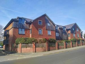 a brick building on the side of a street at Parkside Apartment Normanton in Wakefield