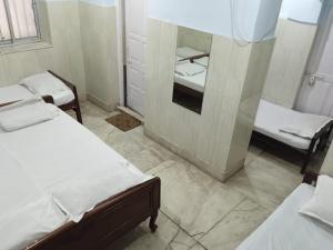 Postel nebo postele na pokoji v ubytování Centerpoint Guest House