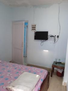 Postel nebo postele na pokoji v ubytování Centerpoint Guest House