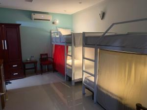 a room with two bunk beds in a room at Central Beach Hotel in Da Nang